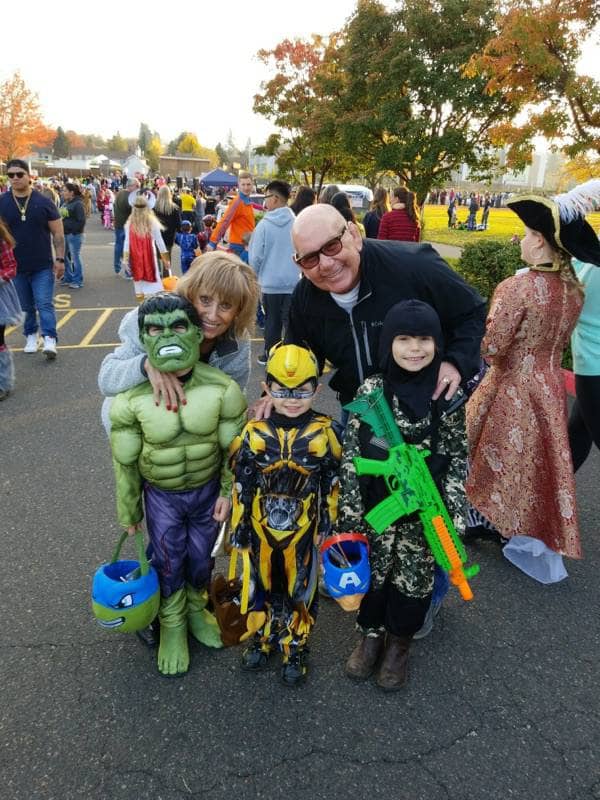 Pictured (back to front): Nickie and Mike Hagan; Noah (Hulk), Zander (Transformer), and Jaxon (Ninja)